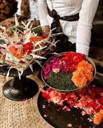Vibrant Balinese offering with colorful flowers and ritual items